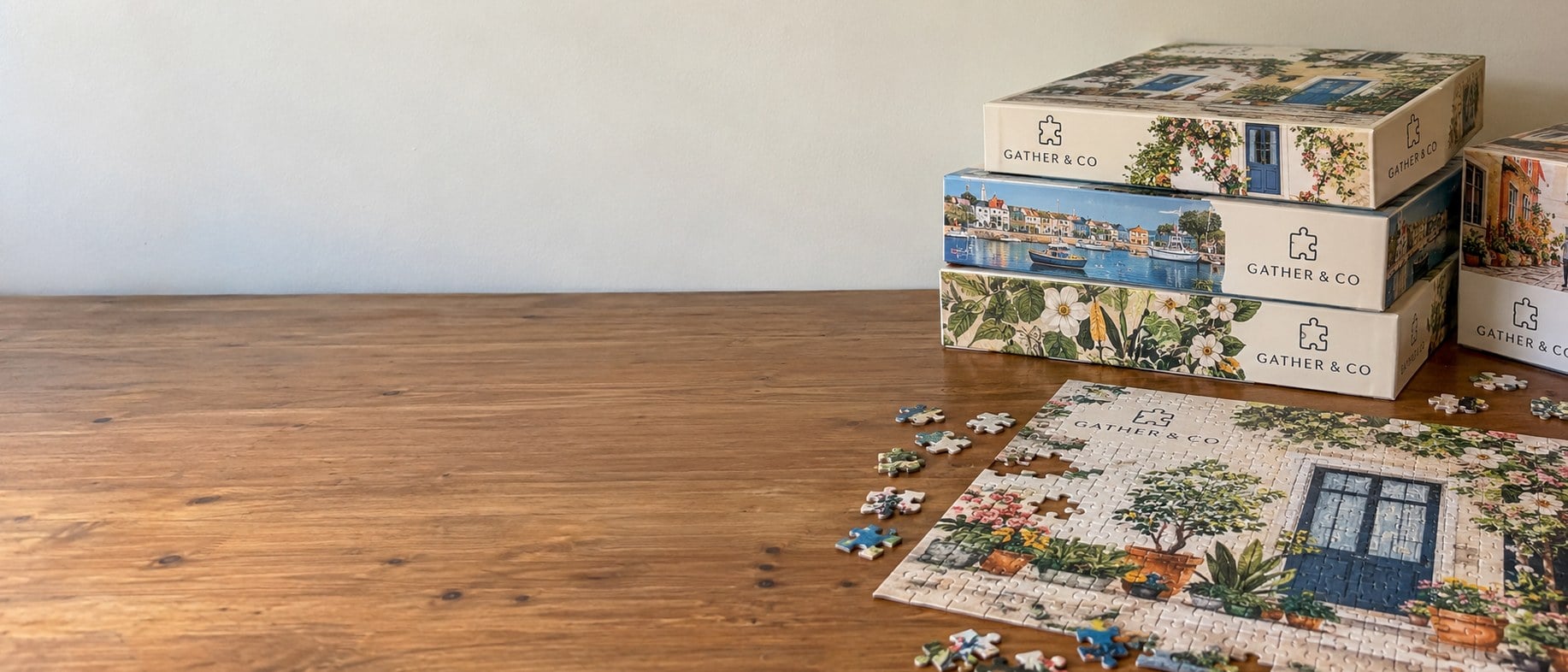Custom jigsaw puzzles in bulk with branded boxes on a table